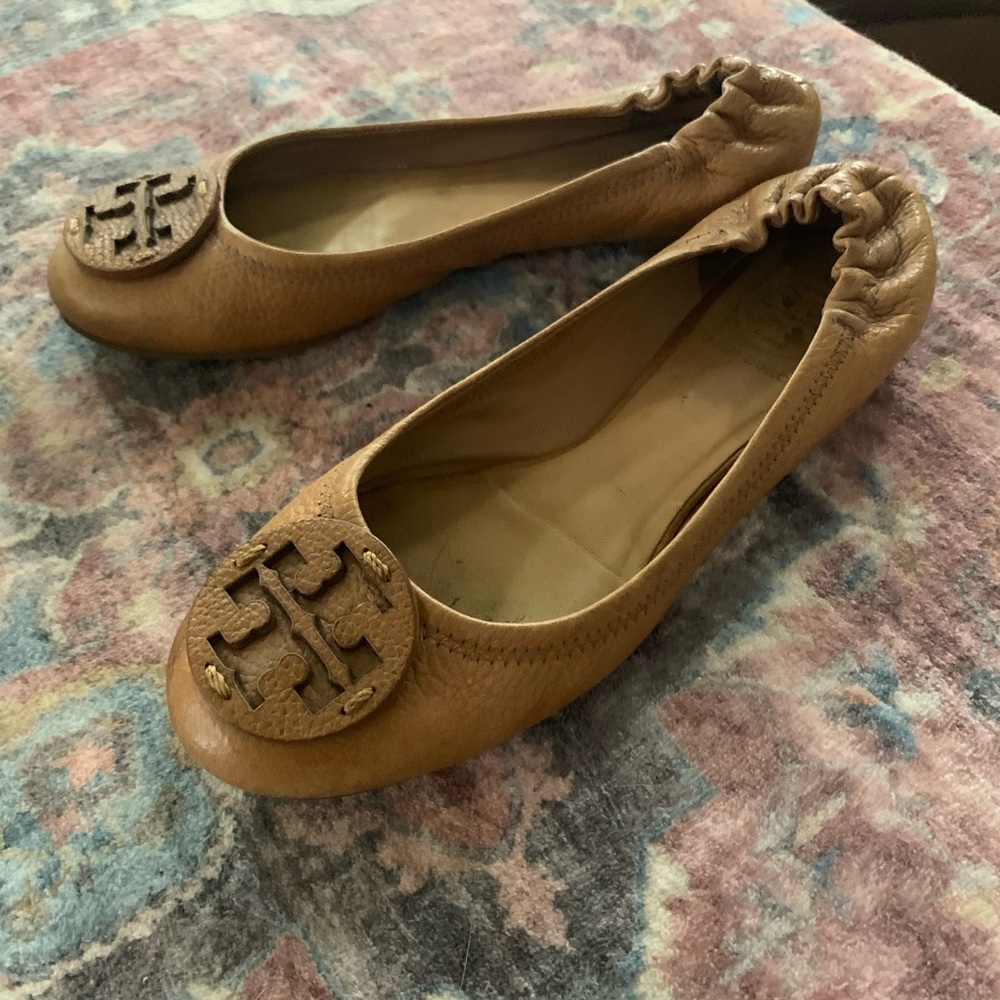 Tan Tory Burch flats. Normal wear.